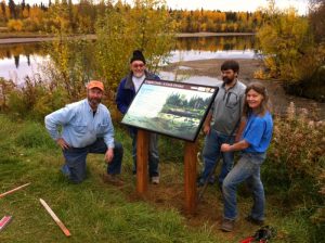 Interior Alaska Land Trust board members show off an interpretive signs at the mouth of Cripple Creek in Fairbanks. Photo- Sam Dashevsky 