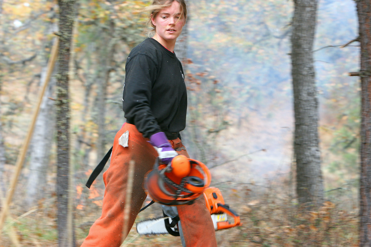 In addition to providing bird habitat, oaks are also drought and fire resistant– an increasingly important characteristic in the region’s warming climate.<br>
Shown: Lindsay Cornelius, Natural Area Manager at Columbia Land Trust, works on a restoration project in the East Cascades. <br> © Rollin Bannow