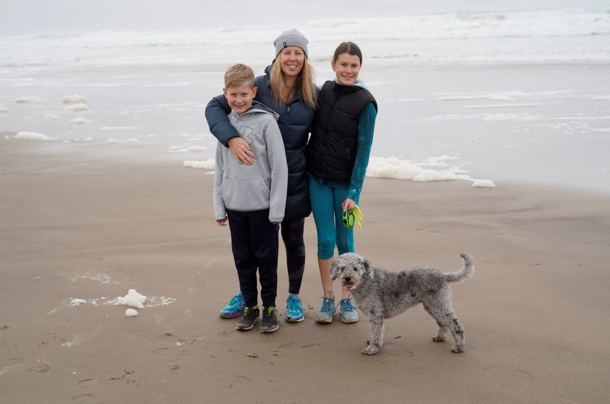 Heather with her son, daughter, and dog Maisy, while camping at the coast near Manzanita, Oregon.