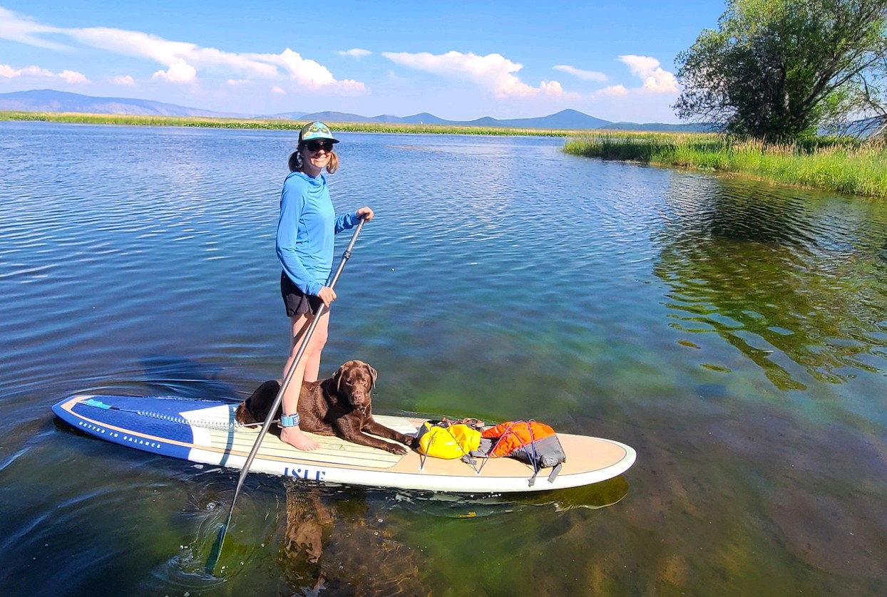 Jaime and her dog Tule paddling on the Upper Klamath Canoe Trail.  Tule is named after the sedges that grow in the shallow water of marshes and lakes. 