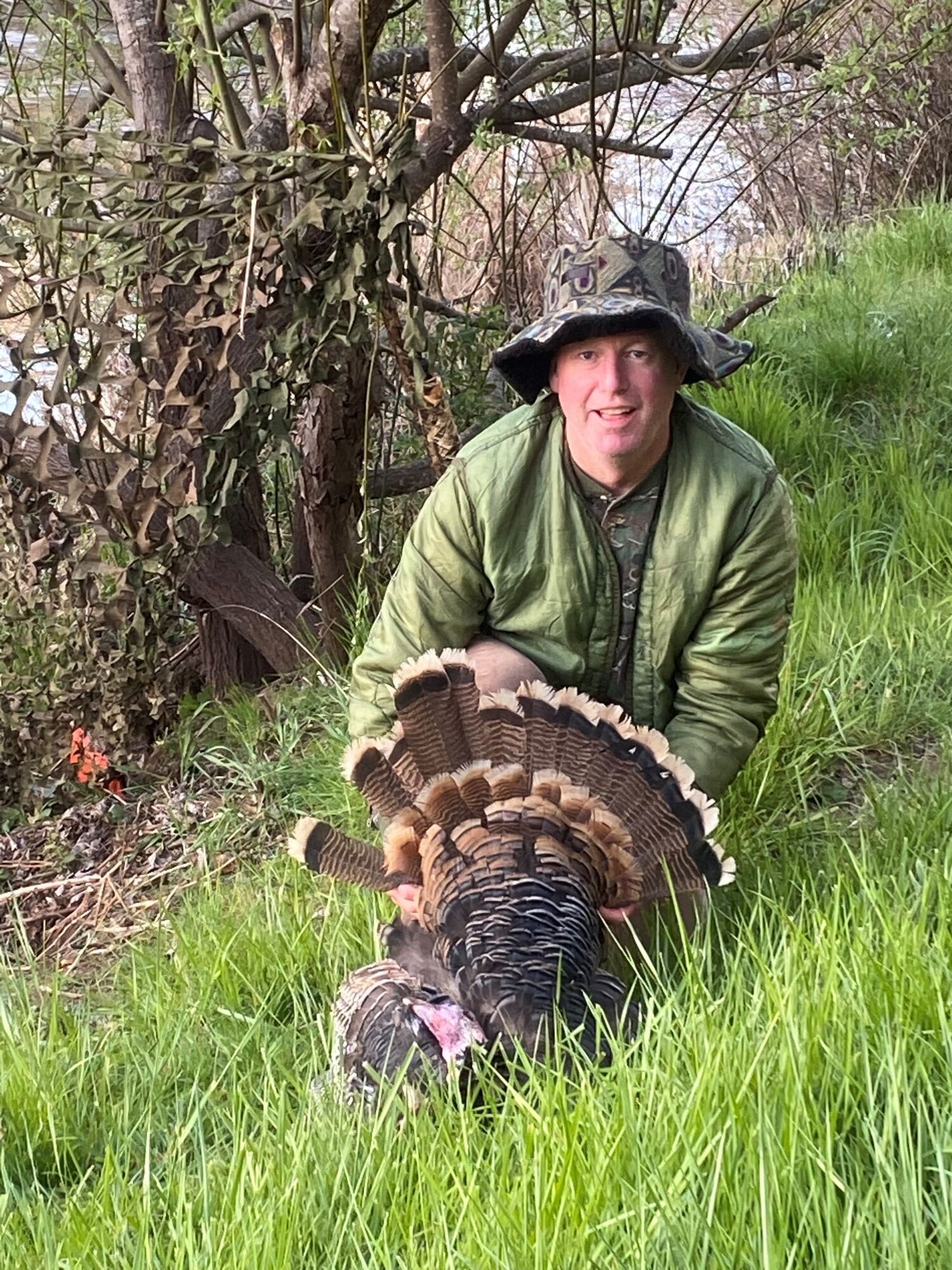 Eric after a successful turkey hunt, one of his hobbies outside of work.