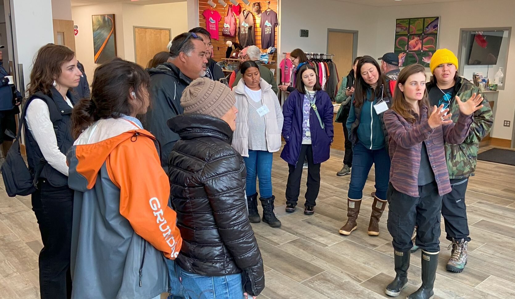 Group discussion in store with winter clothing display