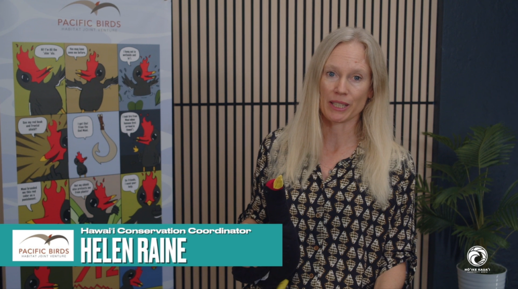This photo shows Pacific Birds employee Helen Raine holding a bird stuffed animal.