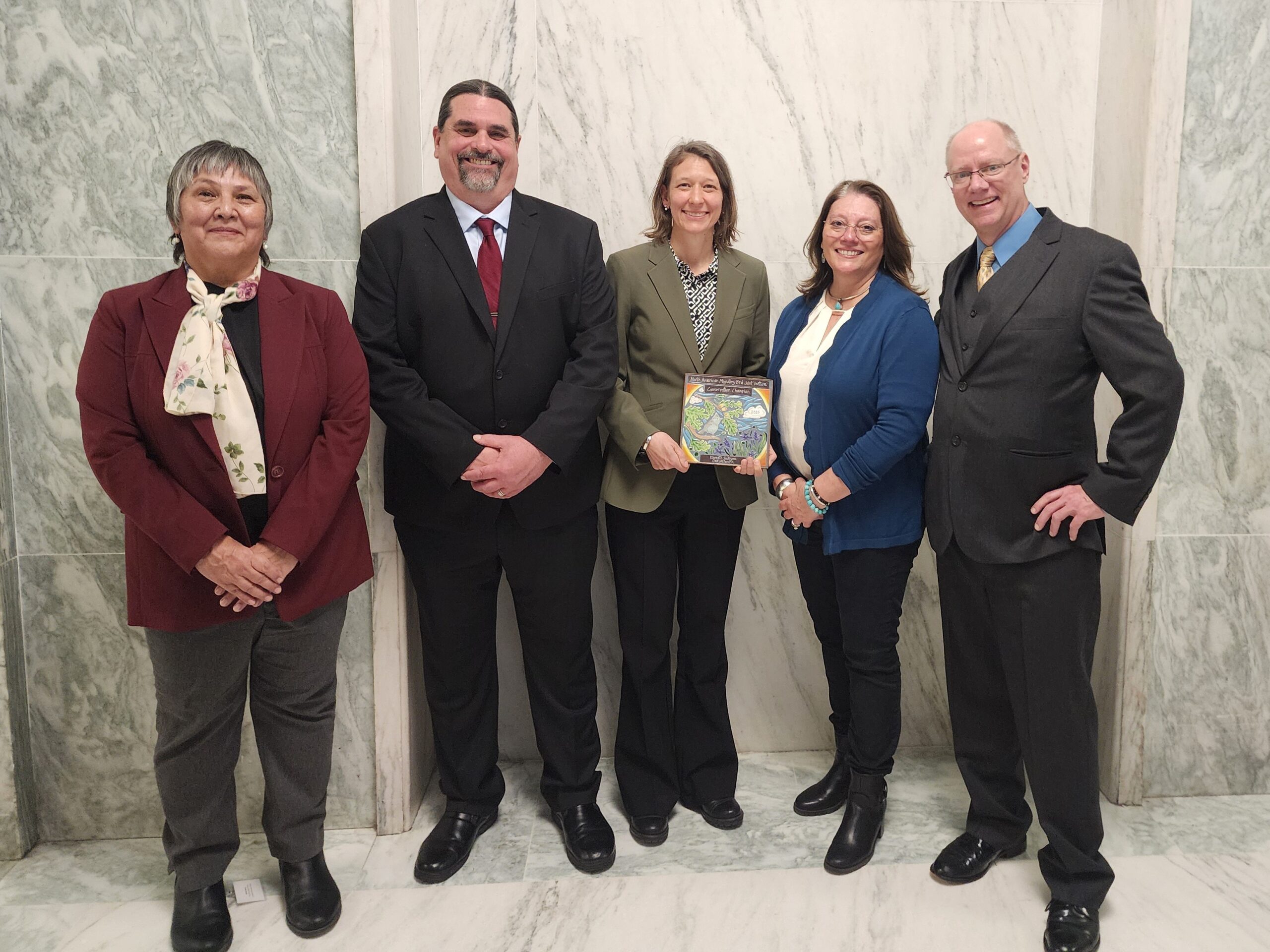 Members of the Klamath Siskiyou Oak Network pose for a photo with the Conservation Champion Award.