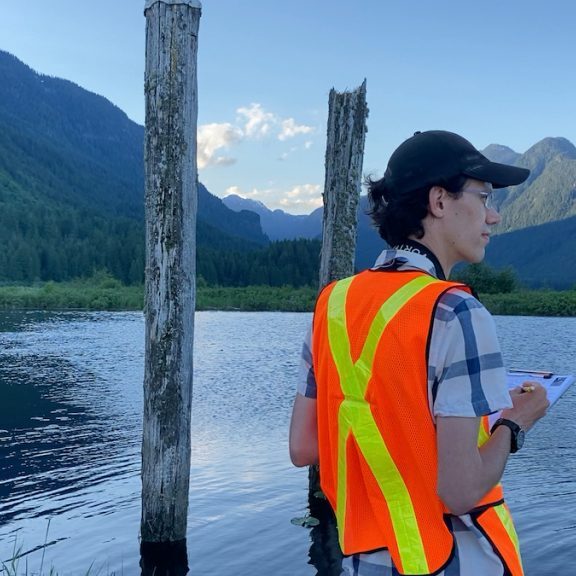 Brendan Toews conducting a bird survey in Widgeon Valley, British Columbia, as part of an ongoing monitoring initative.<br> © Maddie Edmonds