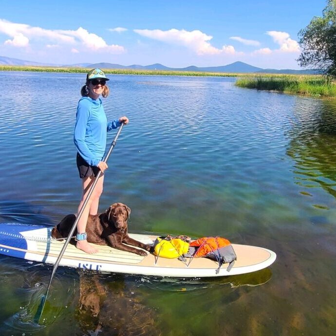 Jaime and her dog Tule paddling on the Upper Klamath Canoe Trail.  Tule is named after the sedges that grow in the shallow water of marshes and lakes. 