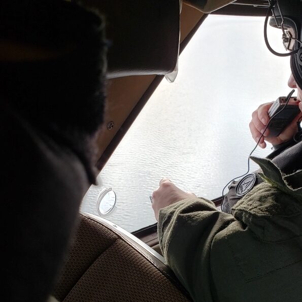 Washington Department of Fish and Wildlife aerial survey observer recording counts of all marine birds and mammals seen along transects flown over Washington’s waters of the Salish Sea.<br>Joseph R. Evenson, Washington Department of Fish and Wildlife